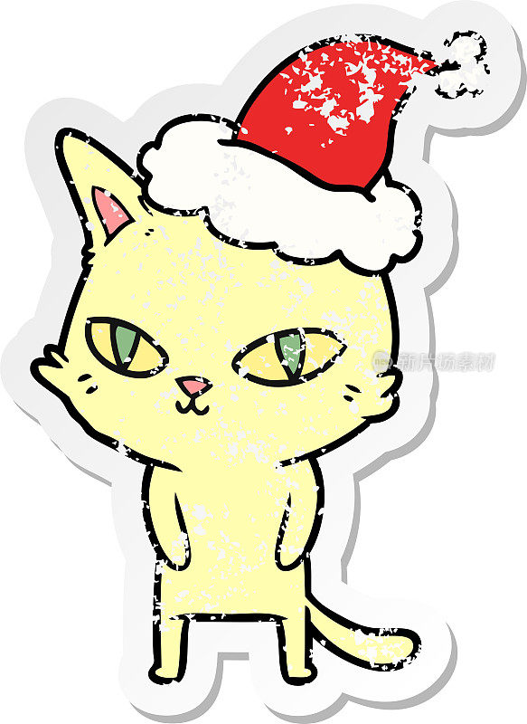 手绘苦恼贴纸卡通猫明亮的眼睛戴着圣诞老人的帽子