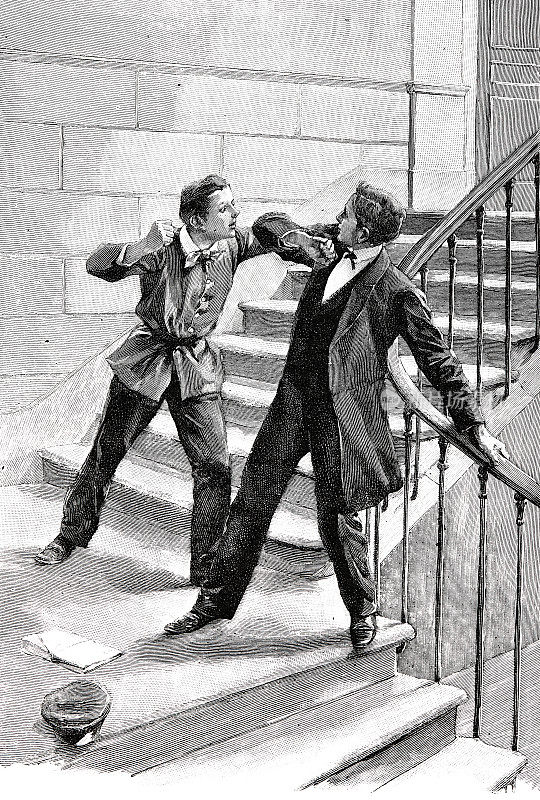两个男孩在楼梯上打架