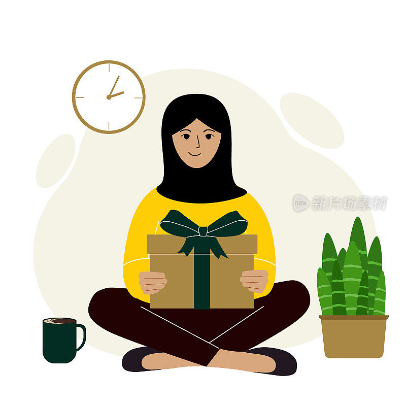 一位裹着头巾的穆斯林妇女抱着一份礼物，双腿交叉坐着。拿着礼品盒的年轻女子