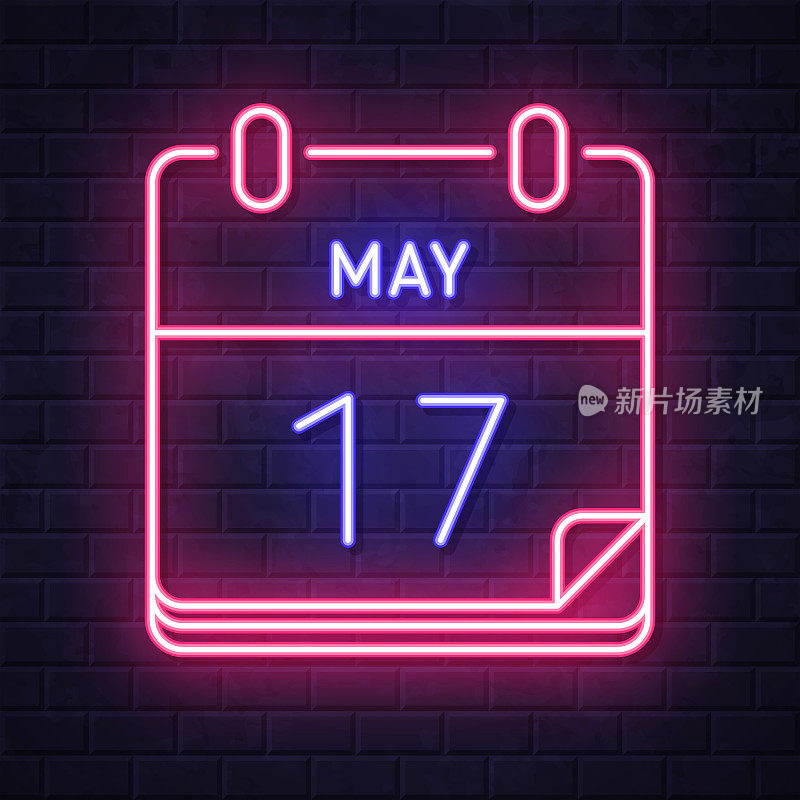 5月17日。在砖墙背景上发光的霓虹灯图标