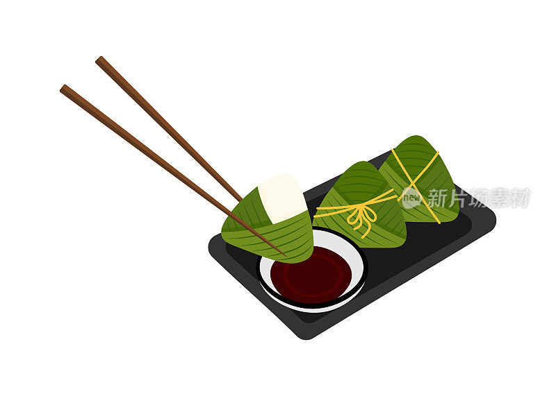 粽子、酱油和筷子放在盘子里