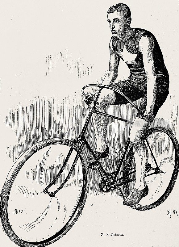 骑自行车的j。约翰逊，坐在他的自行车上，从侧面看