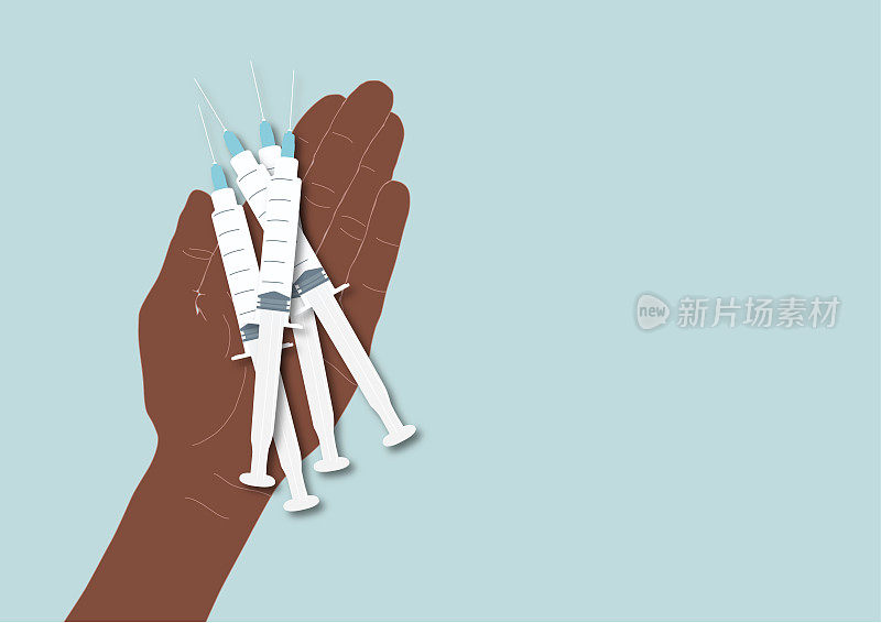 一只拿着注射器的手。疫苗接种