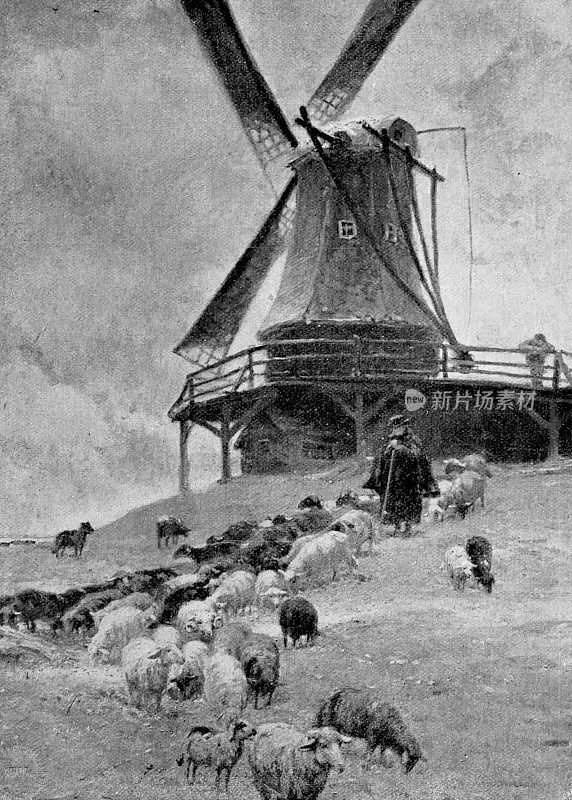 山上的老风车和前面的牧羊人