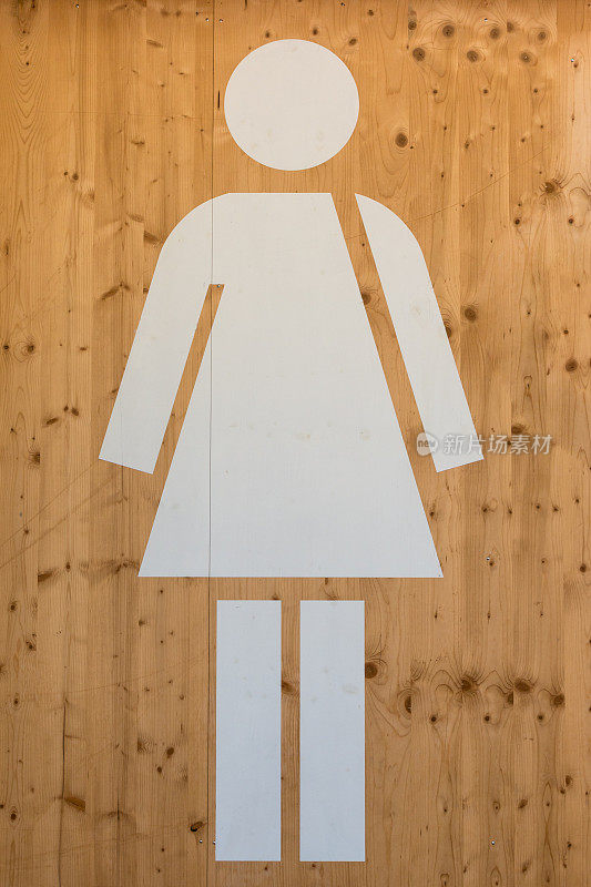 女性厕所标志，木质背景上的白色厕所标志