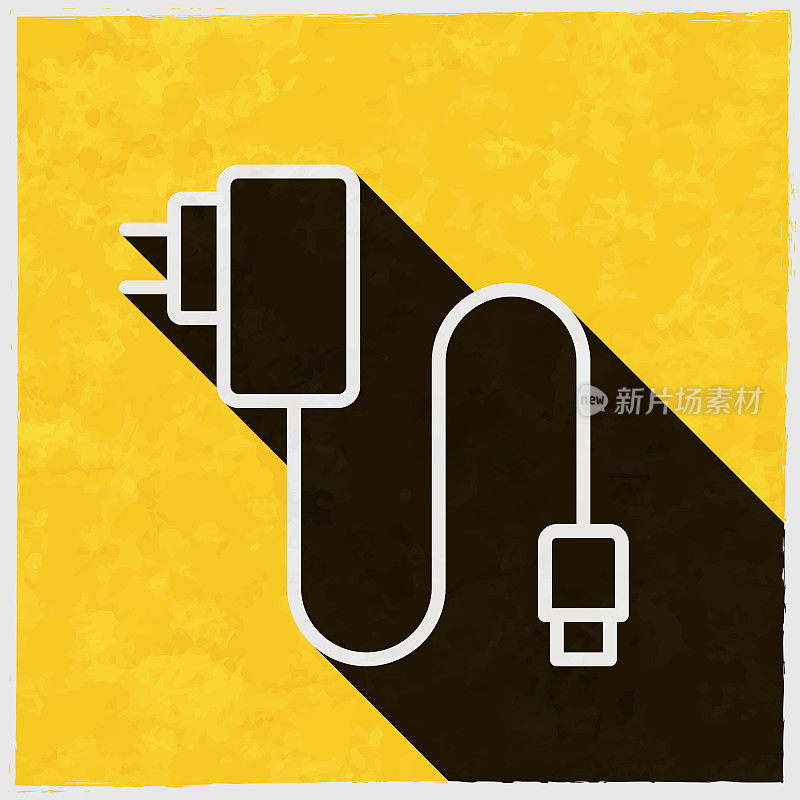 手机充电器。图标与长阴影的纹理黄色背景