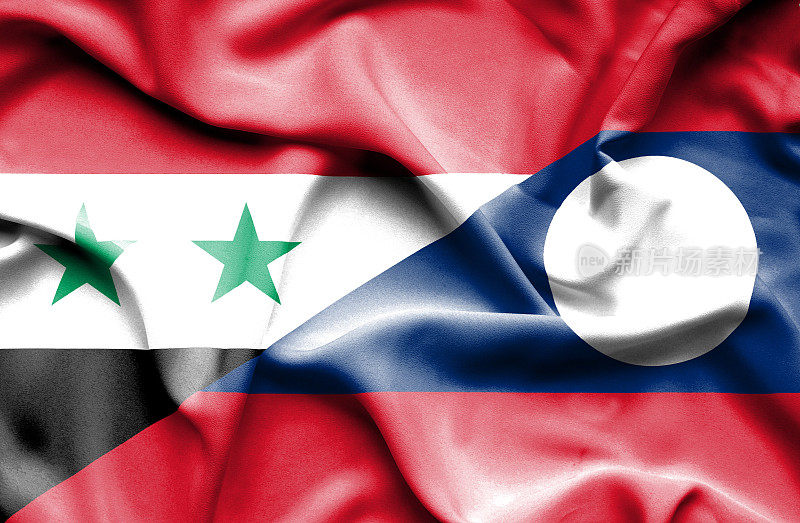挥舞着老挝和叙利亚的旗帜