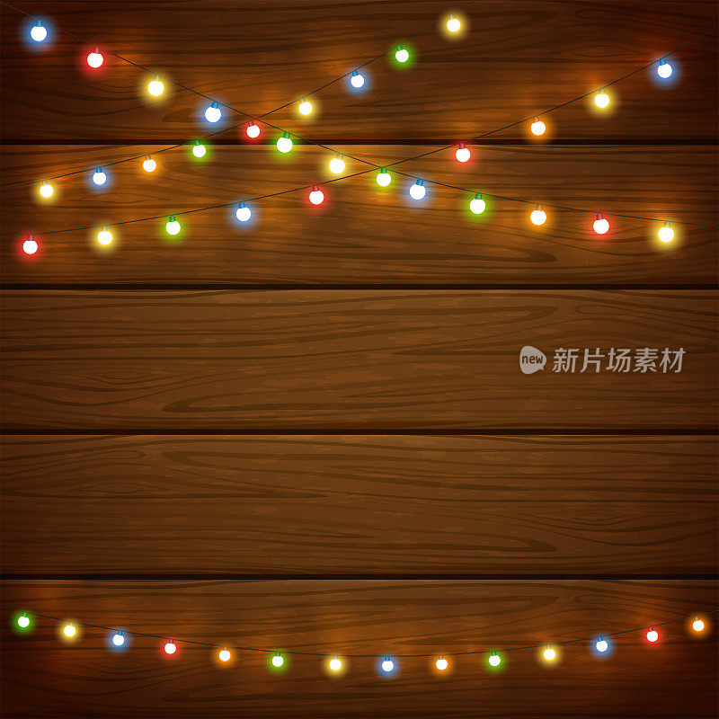 木制背景与五颜六色的圣诞灯