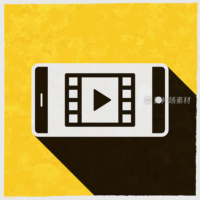 在智能手机上看视频。图标与长阴影的纹理黄色背景