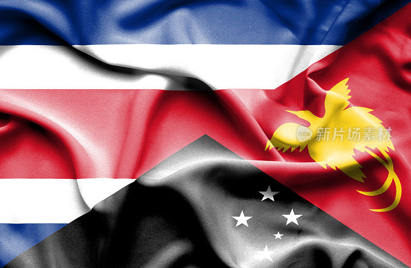 挥舞着巴布亚新几内亚和哥斯达黎加的旗帜
