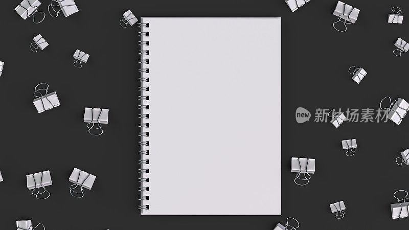 黑色桌子上有白色活页夹的空白螺旋笔记本