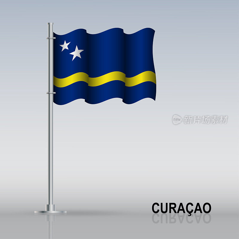 桌上立着旗杆上飘扬的库拉索岛国旗