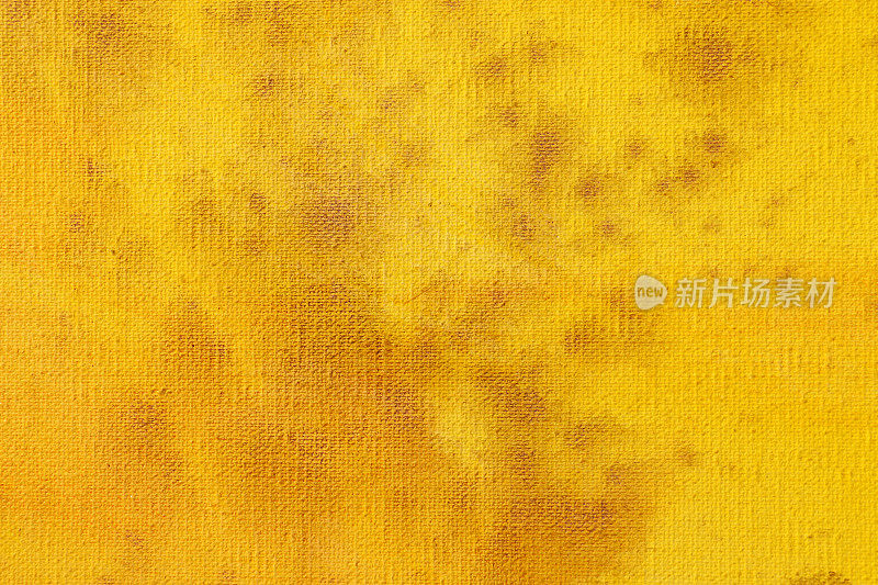 黄色抽象艺术背景。画布上的丙烯酸染料。温暖的颜色。柔和的油漆笔触。