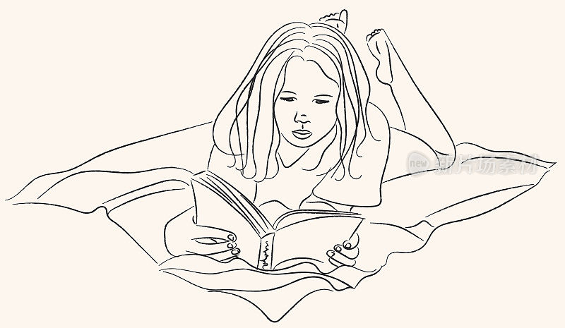 女孩躺在毯子上看书
