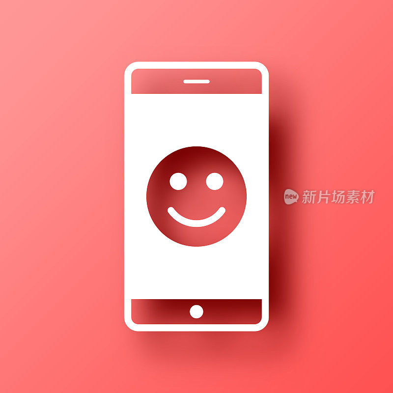 有快乐表情的智能手机。图标在红色背景与阴影