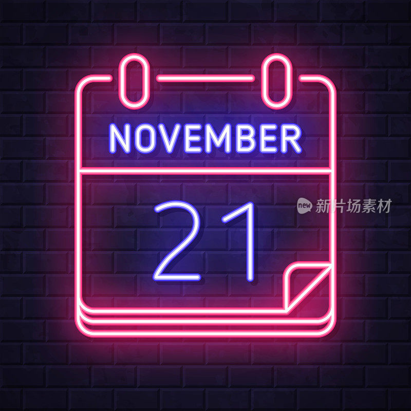 11月21日。在砖墙背景上发光的霓虹灯图标