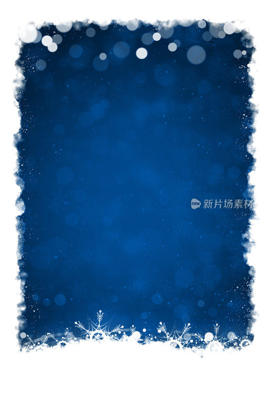 白色的边界或褶边的雪和空灵的闪光的圣诞雪花在底部的一个充满活力的深蓝垂直闪光的节日圣诞背景与气泡像圆或点