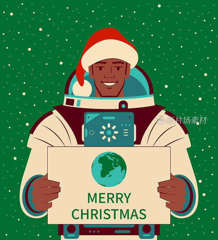 微笑英俊的宇航员(宇航员)戴着圣诞老人的帽子，拿着一个标志地球的符号和圣诞快乐的文字