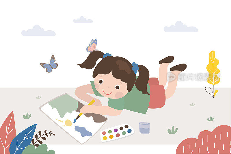 可爱的小女孩躺在草地上用颜料画风景。快乐的孩子在大自然中玩耍。白人小女孩画家用水彩画。教育、艺术