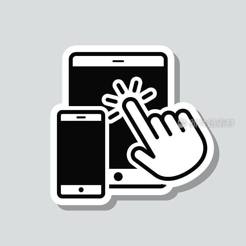 手触摸平板电脑和智能手机。图标贴纸在灰色背景