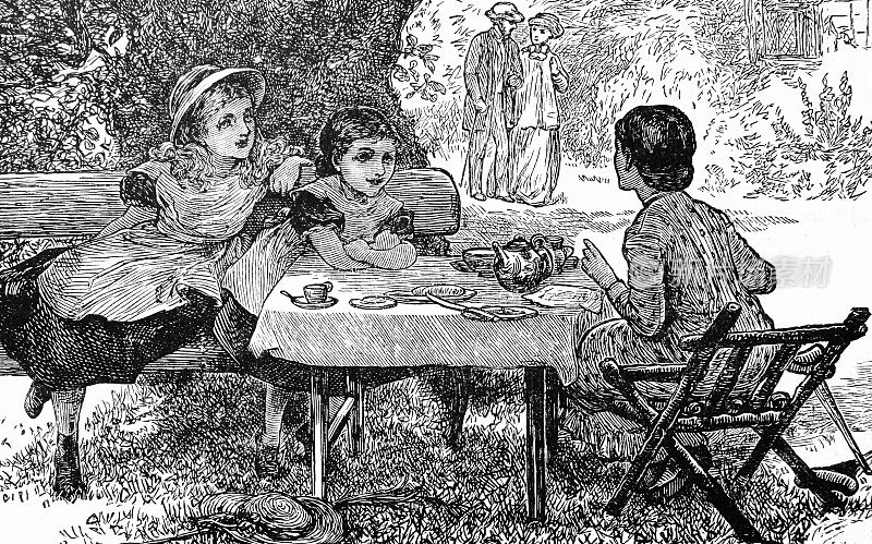 母亲和两个女孩在花园里喝茶