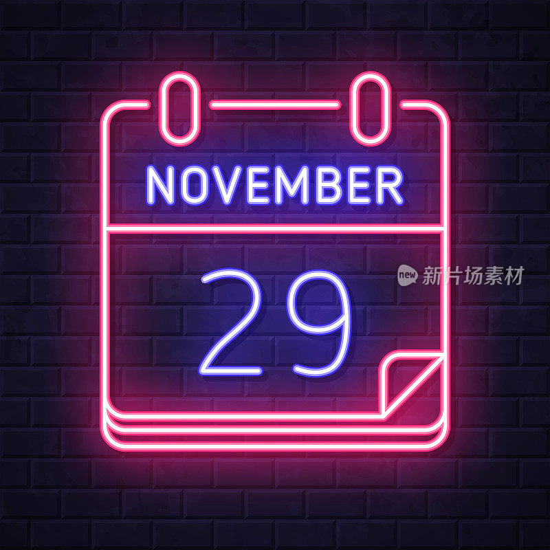 11月29日。在砖墙背景上发光的霓虹灯图标