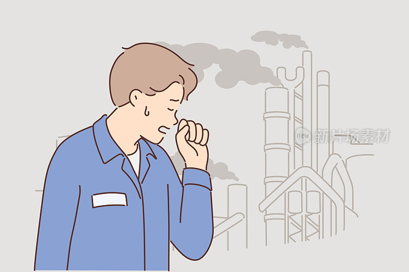 一名男子站在化工厂烟囱里冒出有毒烟雾的工厂附近咳嗽
