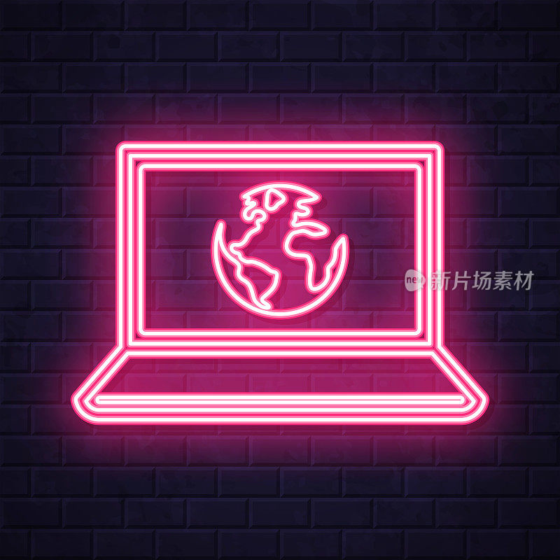 笔记本电脑与地球。在砖墙背景上发光的霓虹灯图标