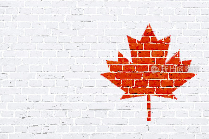 横白砖墙上绘有一面红色的加拿大国旗枫叶旗作为涂鸦