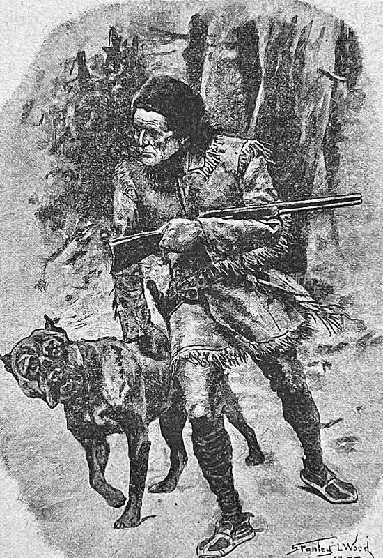 猎人手持来复枪，带着他的狗在森林里散步