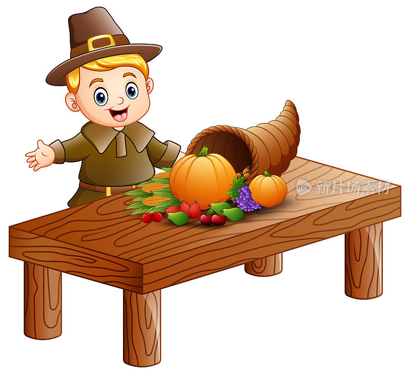 朝圣者男孩与丰富的水果和蔬菜在木桌上