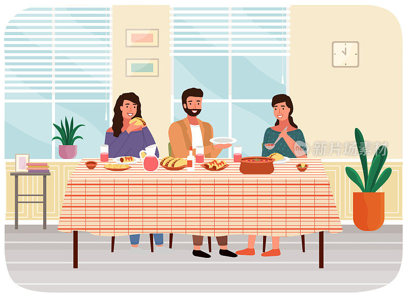 一群人，家人或朋友在家里一起吃饭。人物在吃墨西哥菜