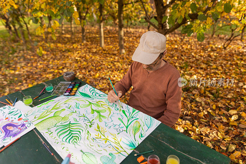 一个艺术家在他的花园里工作的彩色景象