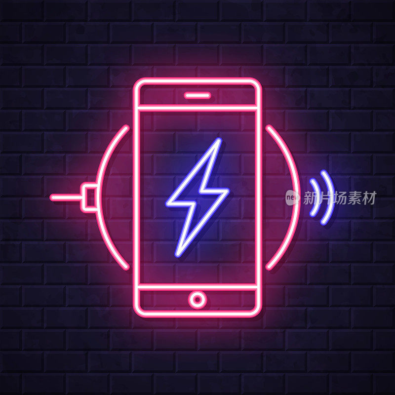 智能手机充电无线充电器。在砖墙背景上发光的霓虹灯图标