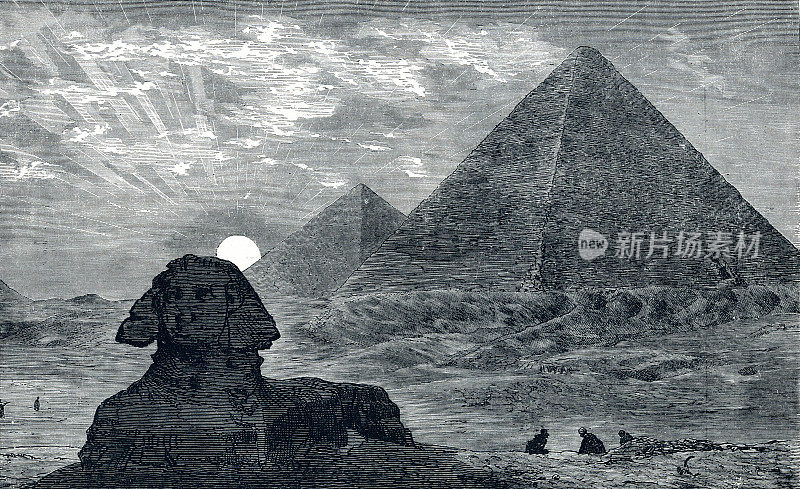 日落时埃及开罗的金字塔和狮身人面像