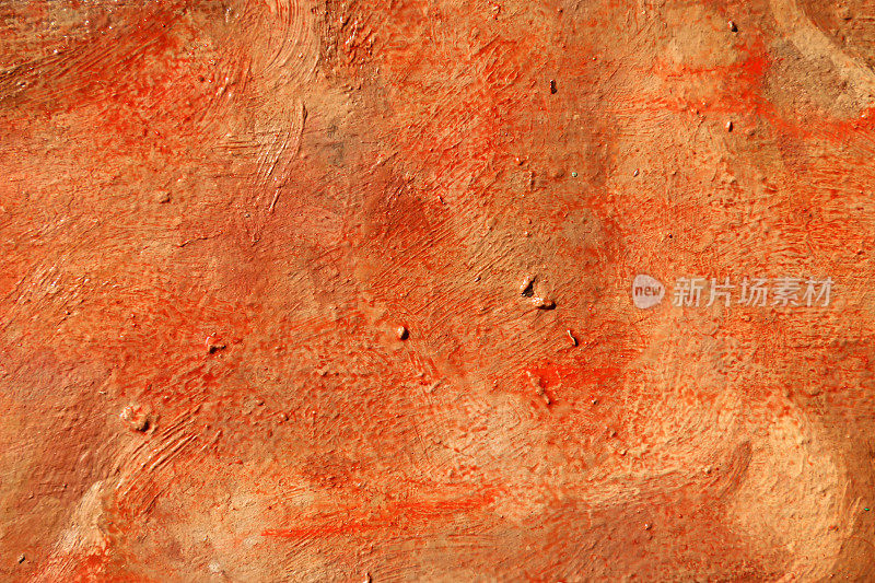 红色抽象艺术背景。画布上的丙烯酸染料。温暖的颜色。柔和的油漆笔触。