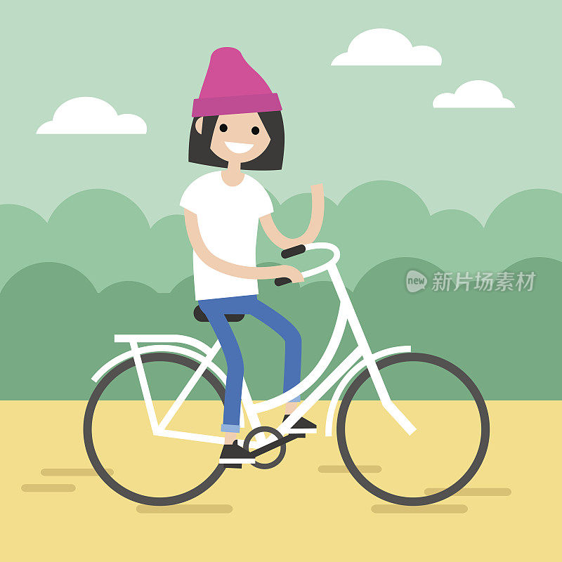 年轻的黑发女孩骑着自行车，挥舞着她的手