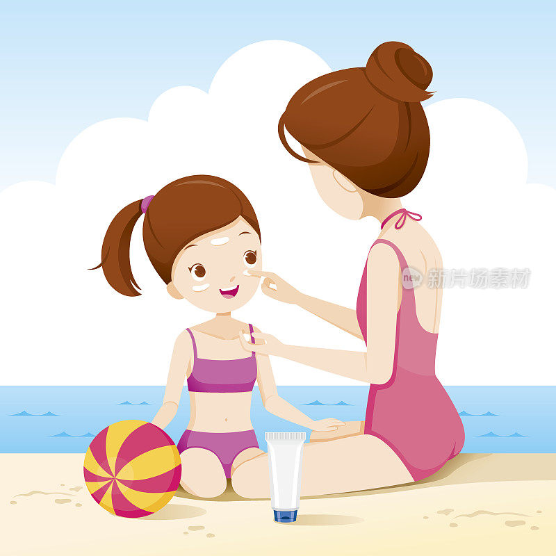 妈妈在沙滩上给女儿涂防晒霜