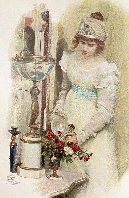 年轻的美女在花瓶里放上一束花