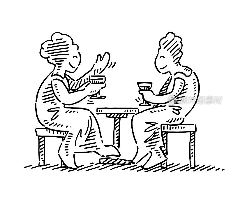 两个女人在咖啡桌上聊天画画
