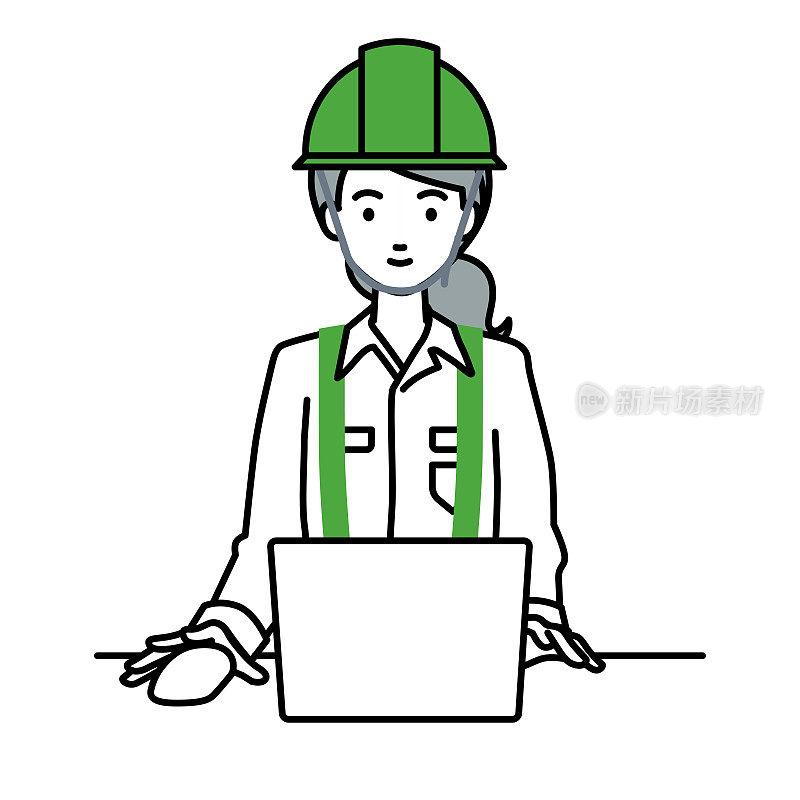 一个在建筑工地工作的女人在她的办公桌上使用笔记本电脑