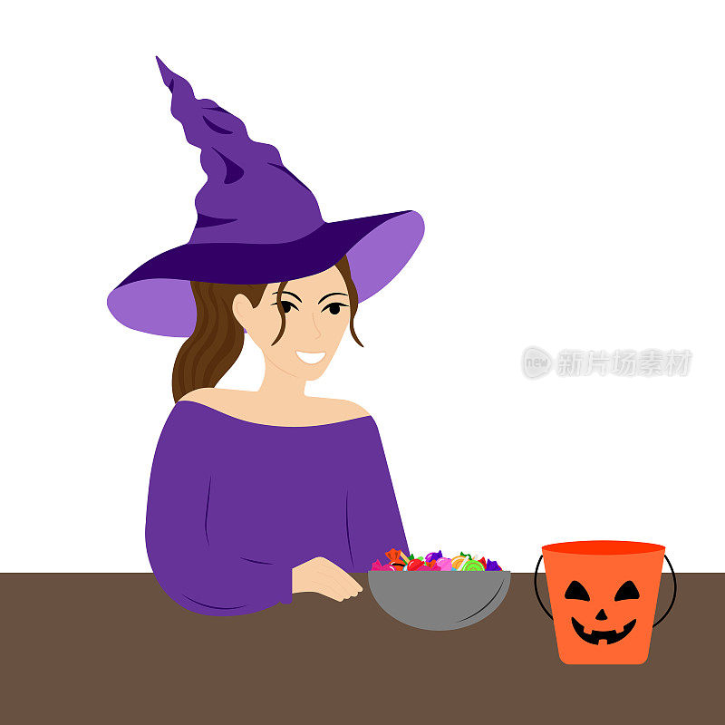 一个穿着女巫服装的年轻女子把万圣节桶里的糖果放进碗里