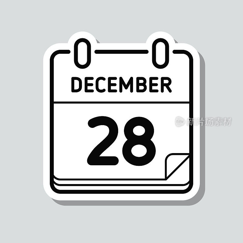 12月28日。灰色背景上的图标贴纸