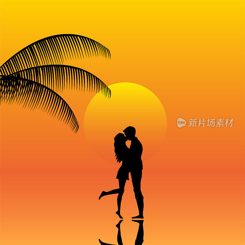 沙滩上一对情侣在夕阳下的风景