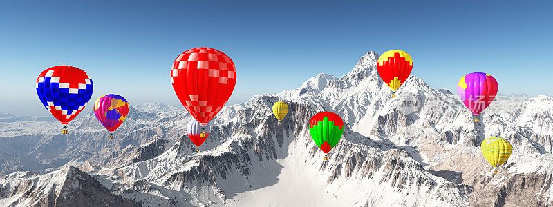 热气球飞过白雪覆盖的山脉