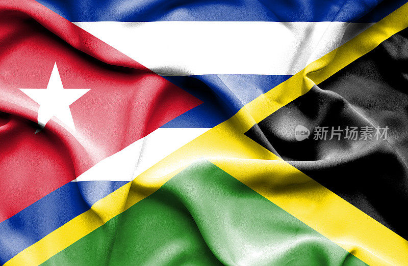挥舞着牙买加和古巴的旗帜