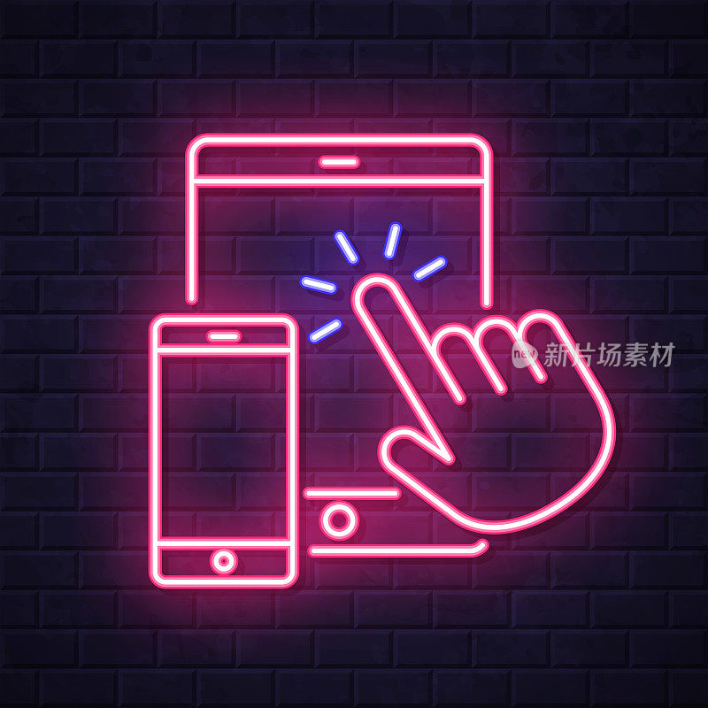 手触式平板电脑和智能手机。在砖墙背景上发光的霓虹灯图标