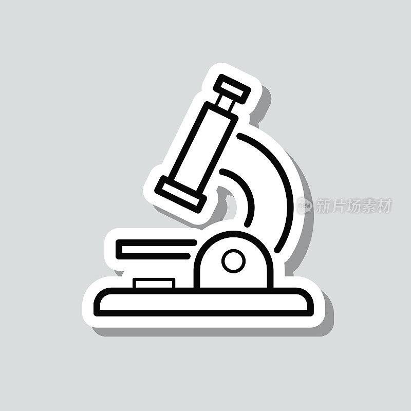 显微镜。灰色背景上的图标贴纸