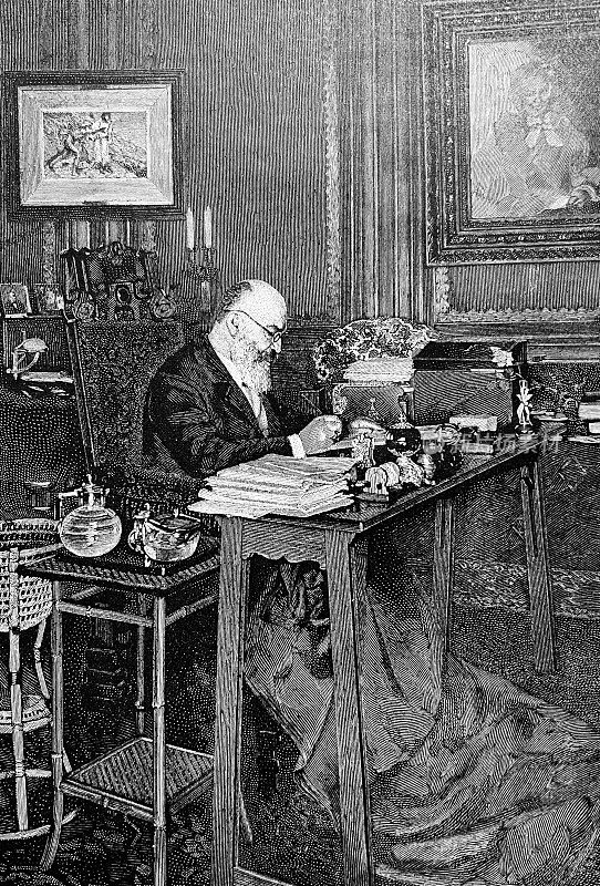 格奥尔格・埃伯斯，德国作家，坐在书房的书桌前