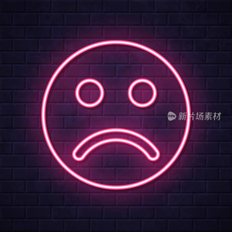悲伤的表情符号。在砖墙背景上发光的霓虹灯图标